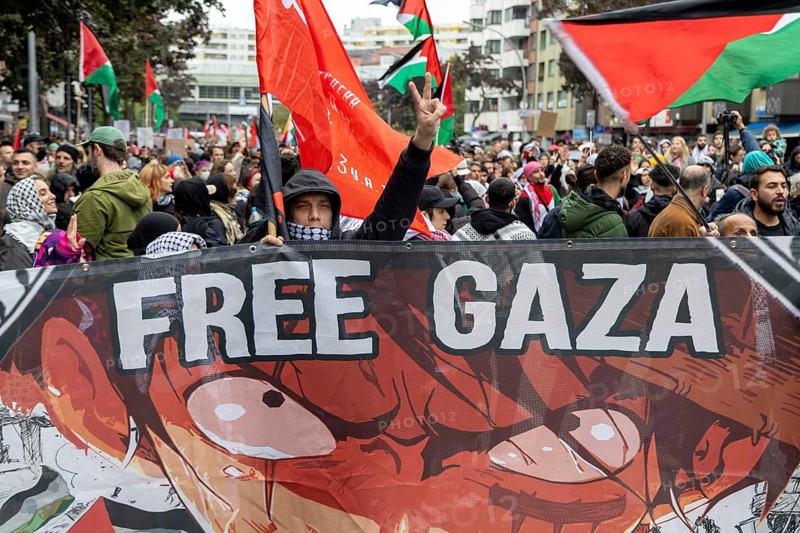 Participants with banner Free Gaza at the pro-Palestinian demonstration in Berlin, Germany, 6.10.2024: Pro-Palestinian demonstrators protest at Kottbusser Tor in Berlin-Kreuzberg under the slogan Demo against genocide in Gaza on the anniversary after radical Islamist Hamas attacked Israel on 7 October 2023, killing over 1, 000 people and kidnapping hundreds in the Gaza Strip, which has been at war with Israel ever since. Berlin, Europe