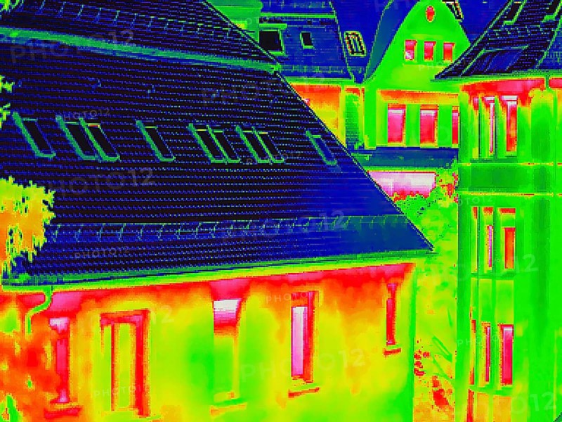 Apartment block, facade of a residential building with windows. Thermal image or thermography, symbol photo, interpolated. Germany