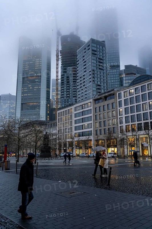 Rainy weather, freezing rain, Goetheplatz, high-rise skyline in clouds, passers-by hurrying through the damp, icy weather, Frankfurt am Main, Hesse, Germany, Europe