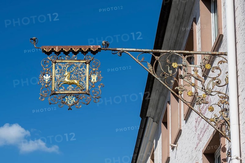 Nose sign, inn sign, blacksmith's art on a house wall with a golden stag, Hüfingen, Black Forest district, Baden-Württemberg, Germany, Europe