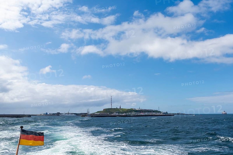 View from south-west to the high sea island Helgoland, harbour facilities, cliff coast, Unterland and Oberland, German flag, radio tower, passenger ship Maud at sea, Hurtigruten Expeditions, North Sea, Pinneberg district, Schleswig-Holstein, Germany, Europe