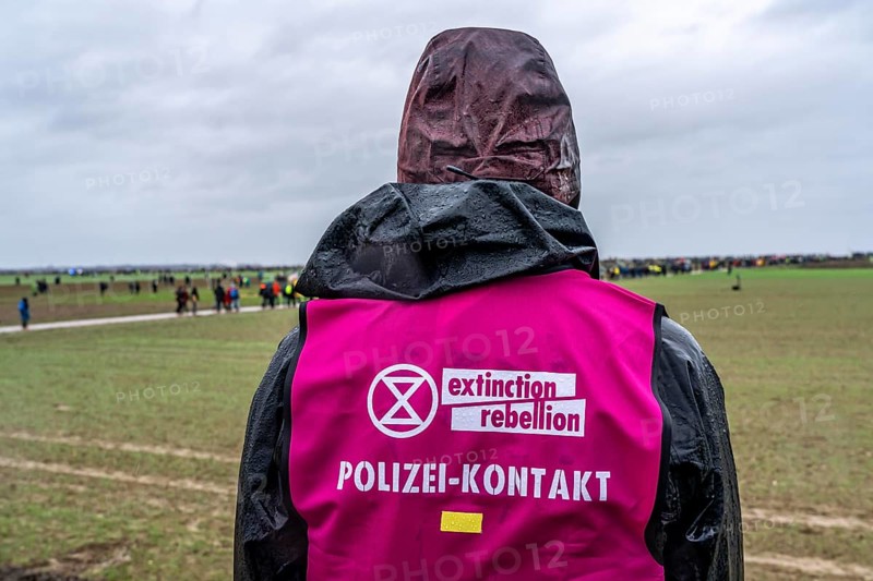 Extinction Rebellion, police contact person, demonstration against the demolition of the lignite village Lützerath, from the village Keyenberg the demonstrators moved to the edge of the Garzweiler opencast mine and on to the rest of the village Lützerah, Erkelenz, North Rhine-Westphalia, Germany, Europe