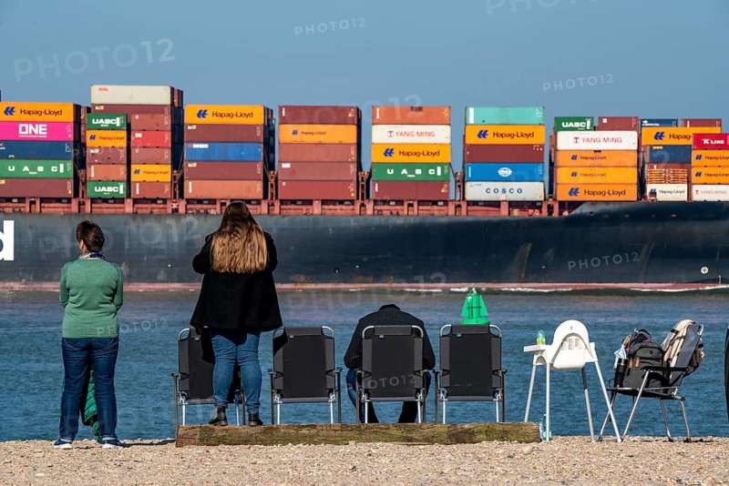 Container freighter Al Manamah, of the shipping company Hapag-Lloyd, in the harbour entrance of the deep-sea port Maasvlakte 2, the seaport of Rotterdam, Netherlands, on an artificial land area off the original coast, spotter