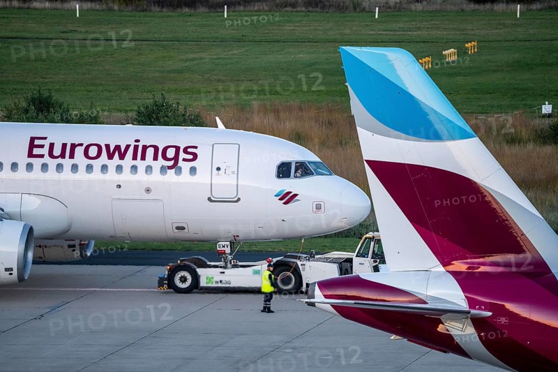 Eurowings aircraft on the apron, being cleared for take-off and pushed from the terminal, Cologne-Bonn Airport, CGN, North Rhine-Westphalia, Germany, Europe