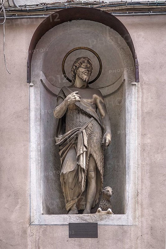 Sculpture of Juesu with the lamb, in a niche on the façade of a residential building, Genoa, Italy, Europe