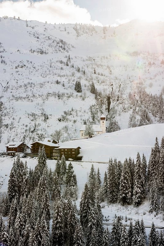 Snow-covered church and village, Sankt Nikolaus, Damüls, Bregenzerwald, Vorarlberg, Austria, Europe