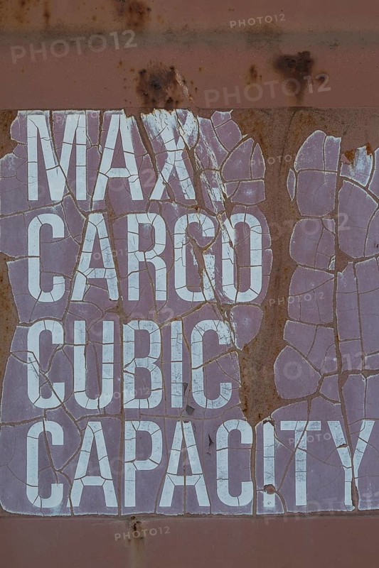 Close-up of maximum cargo cubic weight holding capacity indicated on outside of shipping container, Quebec, Canada, North America