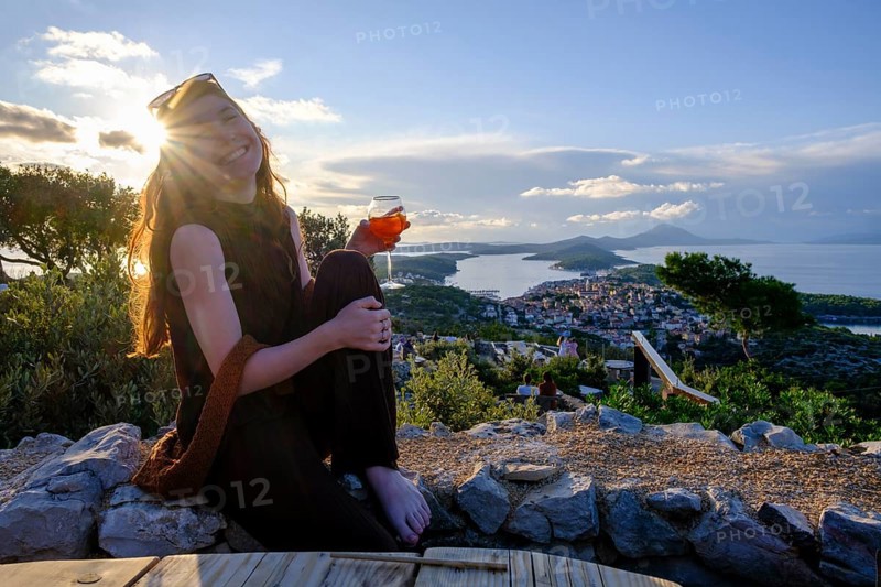 Young woman at the viewpoint, bar and restaurant Providenca, Mali Losinj, island of Losinj, Kvarner Gulf Bay, Croatia, Europe