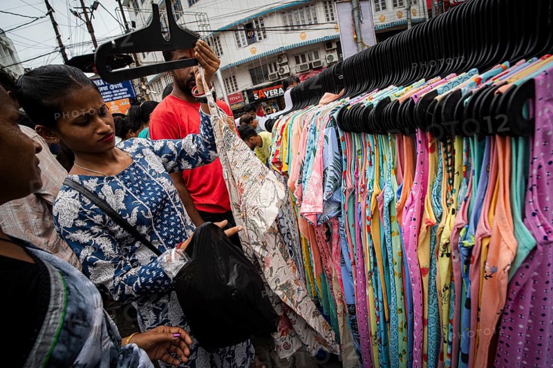 People buys clothes at a street market ahead of Durga Puja festival on October 7, 2024 in Guwahati, India. Shopping ahead of Durga Puja is a major event, as people prepare for the celebration
