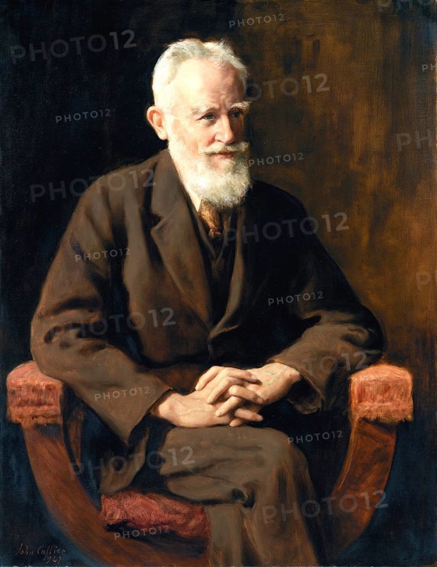 An elderly man with a beard sits in an armchair and looks thoughtful. portrait of George Bernard Shaw, Portrait of George Bernhard Shaw, (26 July 1856, 2 November 1950), an Irish playwright, politician, satirist, music critic and pacifist, who was awarded the Nobel Prize for Literature in 1925, Painting by John Maler Collier (28 January 1850, 11 April 1934), British writer and painter, Historical, digitally restored reproduction from a 19th century original, Record date not stated