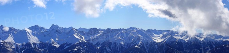 Alpine panorama with snow-covered mountain peaks in winter. Taken in the ski resort of Serfaus Fiss Ladis (Tyrol, Austria)