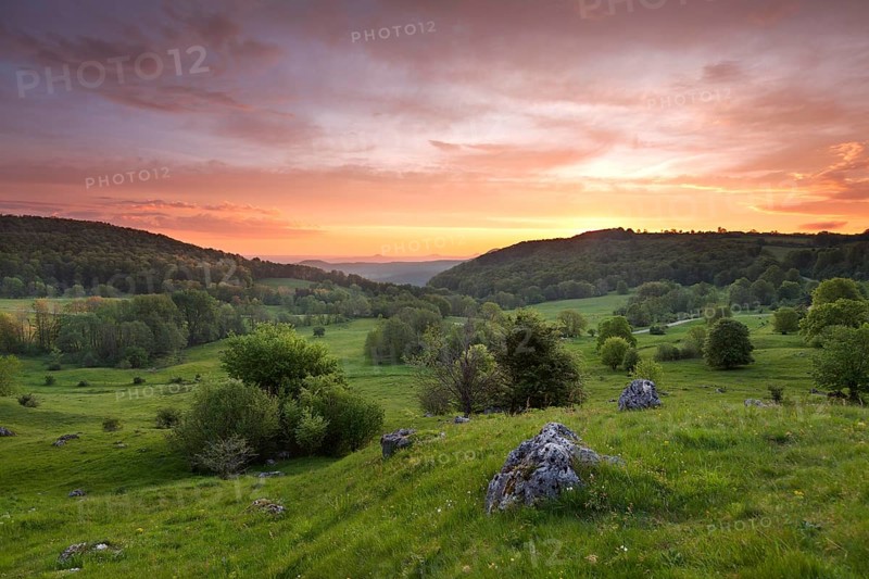 Randecker Maar on the Swabian Alb. Beautiful sunrise with the Drei Kaiser mountains in the distance