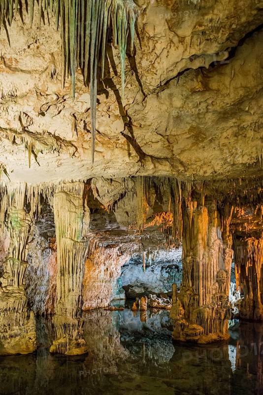 Huge stalactites and underground lake, stalactite cave, Grotta di Nettuno, Neptune Grotto, Capo Caccia, near Alghero, Sardinia, Italy, Europe