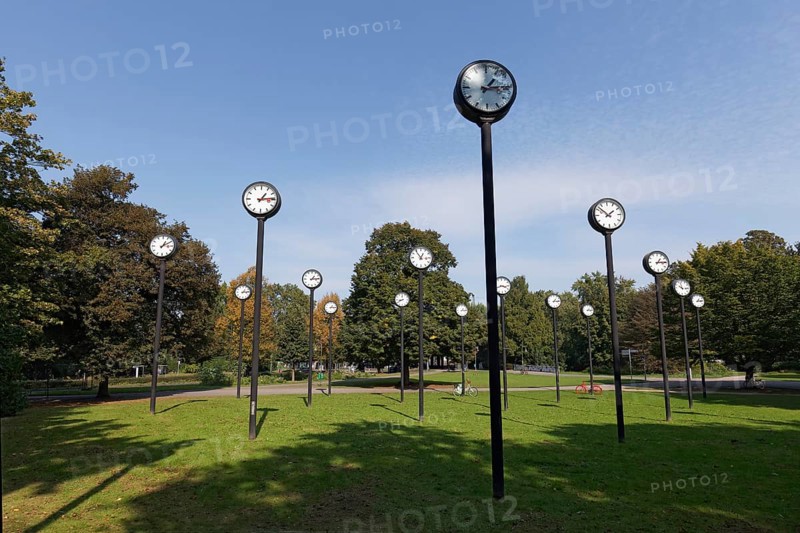 Station clocks with synchronised time, art installation Zeitfeld by Klaus Rinke in the Volksgarten Düsseldorf, North Rhine-Westphalia, Germany, Europe