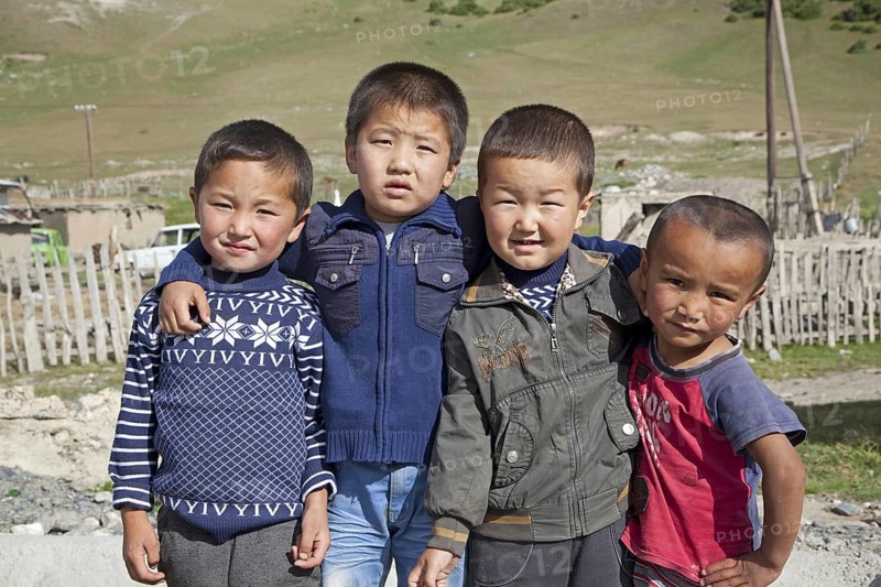 Four young Kyrgyz boys showing Chinese features, Osh Province, Kyrgyzstan, Asia