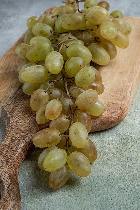 A branch of white grapes, wine grapes, Georgian grape variety Rkatsiteli, top view