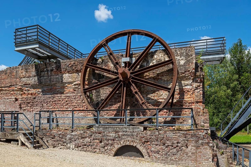 Big winding wheel from colliery headframe at Le Bois du Cazier, coal mining museum at Marcinelle near Charleroi, province of Hainaut, Belgium, Europe