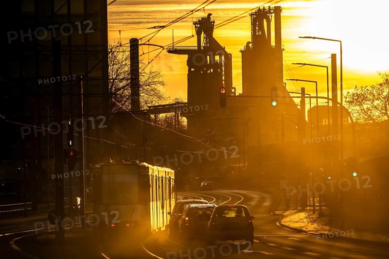 Duisburg-Bruckhausen steel site, ThyssenKrupp Steel, blast furnaces 8 and 9, on Kaiser-Wilhelm-Straße, sunset, tram, North Rhine-Westphalia, Germany, Europe