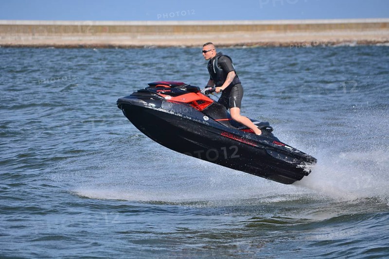 Man on jet ski, water scooter, jumping on Baltic Sea, Swinoujscie, Western Pomerania, Poland, Europe