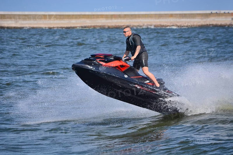 Man on jet ski, water scooter, jumping on Baltic Sea, Swinoujscie, Western Pomerania, Poland, Europe