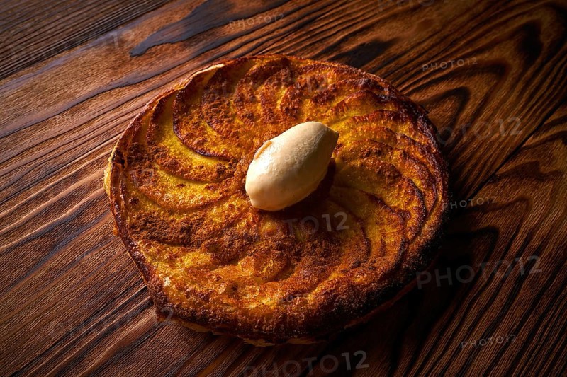 Apple tatin pie cake on puff pastry dessert and ice cream on top