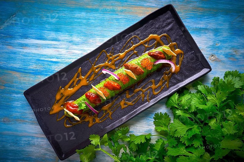 Modern guacamole avocado sauce with fresh coriander