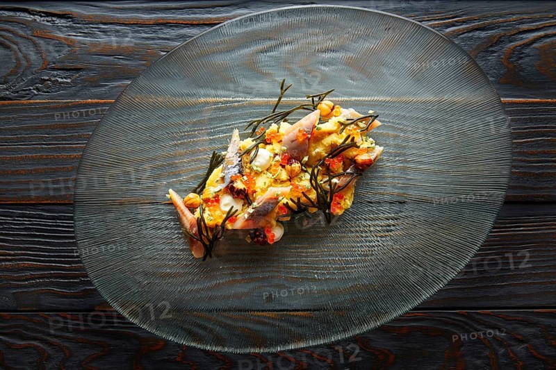 Smoked sardines salad with creamy cheese corn codium and hazelnuts