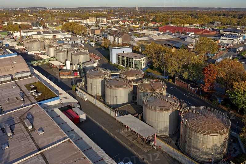 Stainless steel tanks storing chemicals at the Rhine river in Germany. The Chemicals are being repackaged and delivered by truck, box container or tanker to customers