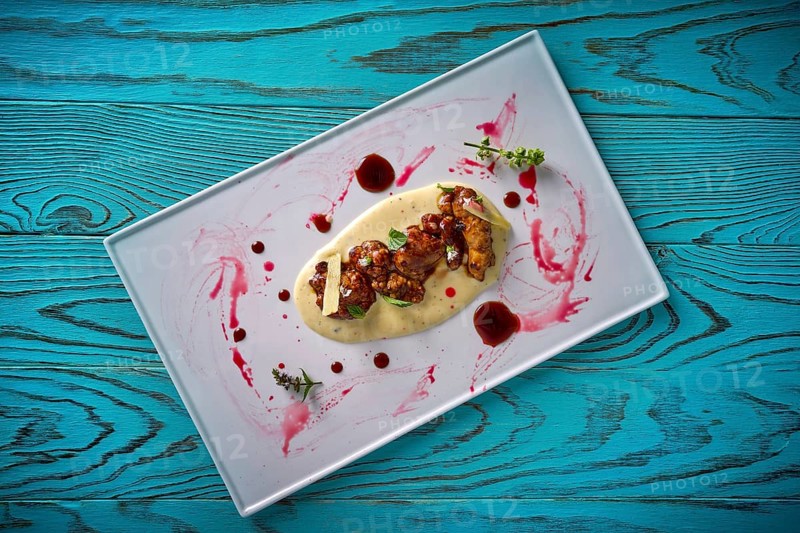 Lamb gizzard recipe on a cream modern cuisine presentation
