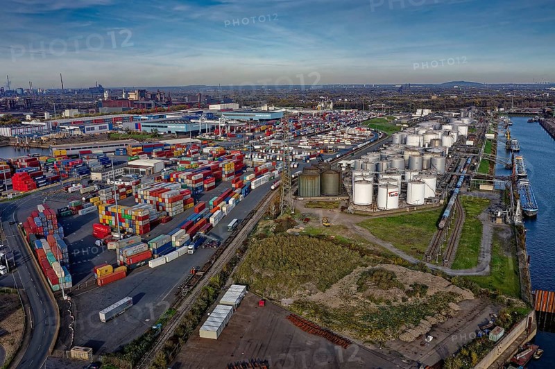 Commercial port with container terminal and oil tanks at the Rhine river in North Rhine-Westphalia, Germany, Europe