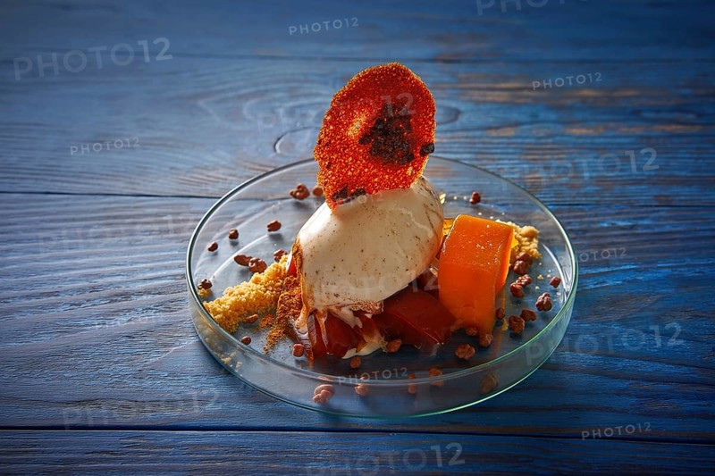 Modern cuisine ice cream dessert with quince vanilla and crunchy