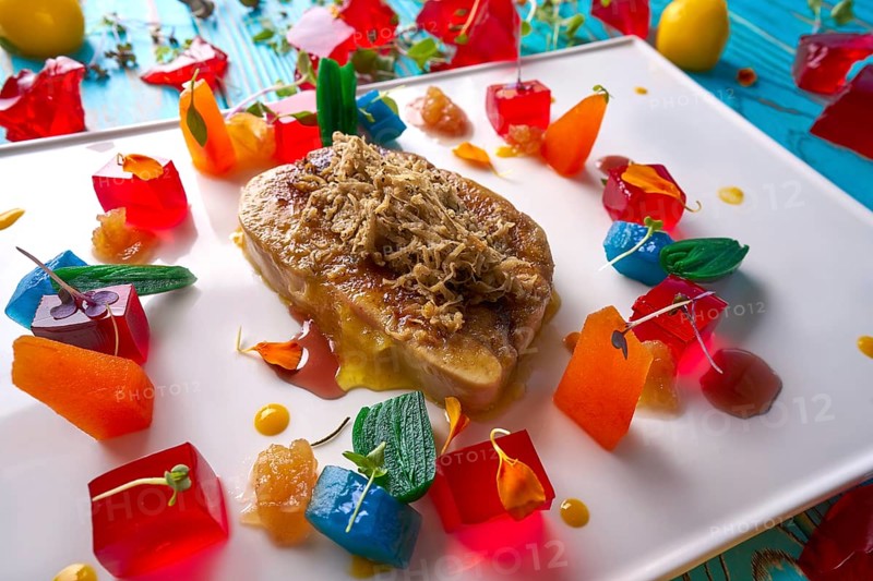 Foie slice with grated white truffle and colorful jelly decoration