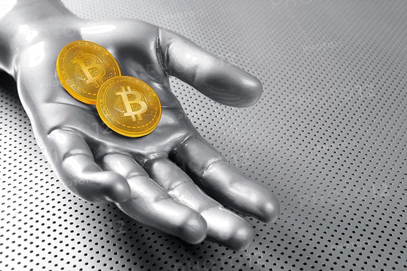 Bitcoin BTC cryptocurrency on silver futuristic hand