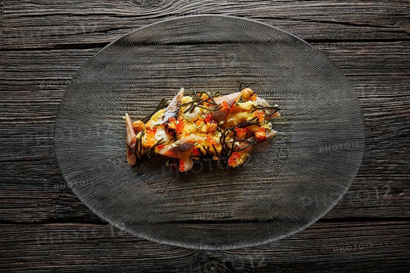 Smoked sardines salad with creamy cheese corn codium and hazelnuts