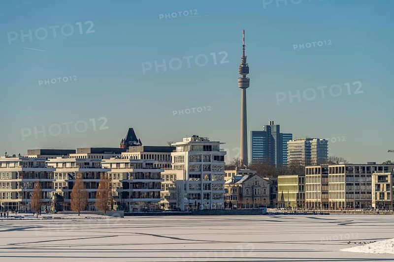 View of the snow-covered and frozen Phoenix Lake and the Florian television tower in Dortmund, North Rhine-Westphalia, Germany, Europe