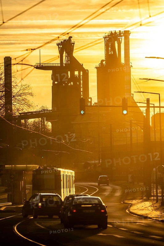 Duisburg-Bruckhausen steel site, ThyssenKrupp Steel, blast furnaces 8 and 9, on Kaiser-Wilhelm-Straße, sunset, tram, North Rhine-Westphalia, Germany, Europe