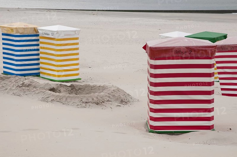 Striped beach chairs in various colours on the sandy beach, Borkum, l North Sea, GERMANY