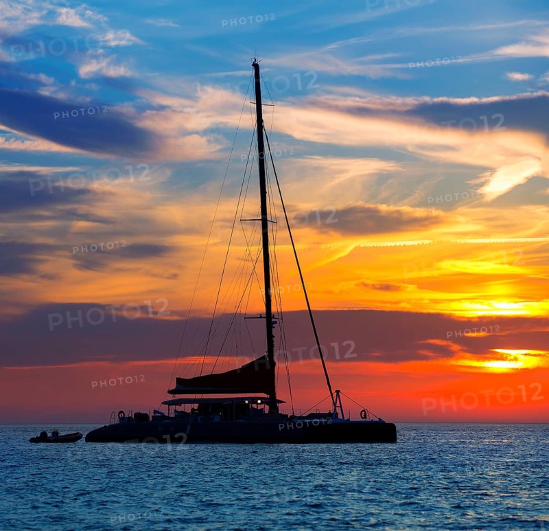Ibiza san Antonio Abad de Portmany catamaran sailboat sunset with in Balearic islands of spain