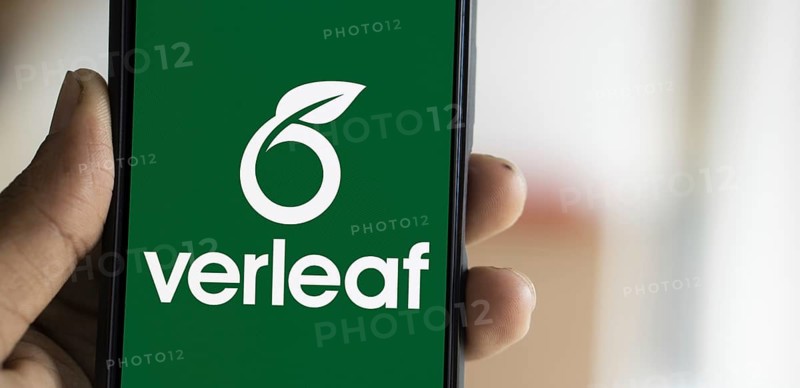 Overleaf logo is displayed on smartphone. Overleaf is a cloud-based LaTeX editor for scientific writing and publishing.