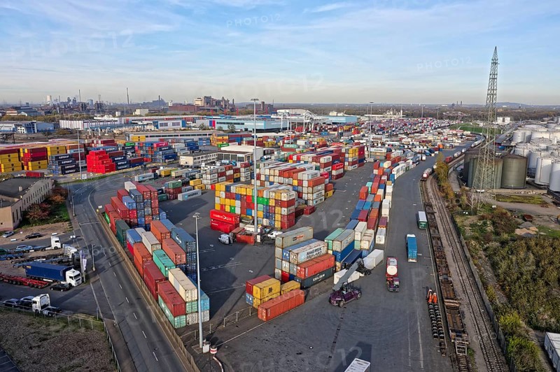 Commercial port with container terminal and oil tanks at the Rhine river in North Rhine-Westphalia, Germany, Europe