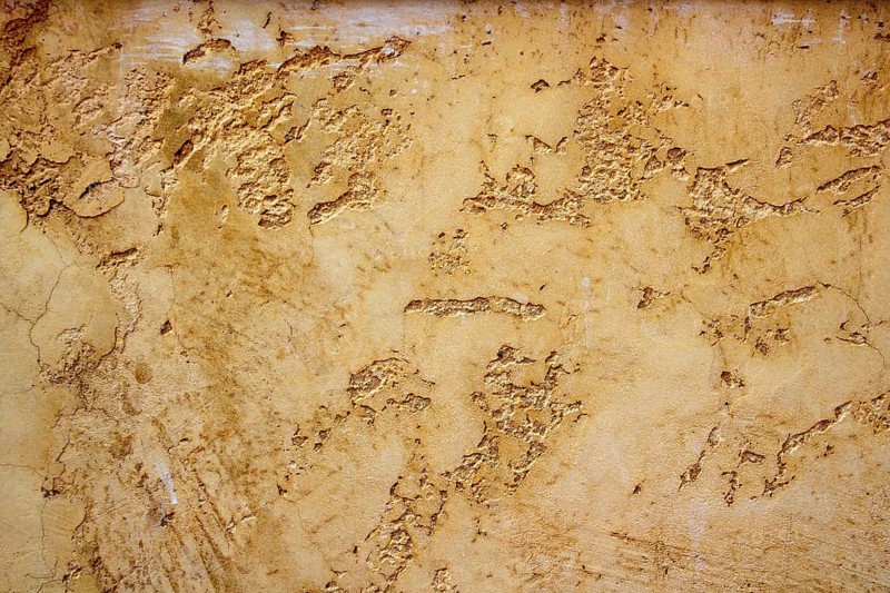 Ocher yellow wall texture grunge background in Mediterranean house