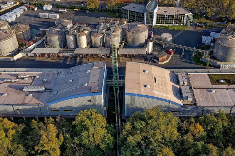 Stainless steel tanks storing chemicals at the Rhine river in Germany. The Chemicals are being repackaged and delivered by truck, box container or tanker to customers