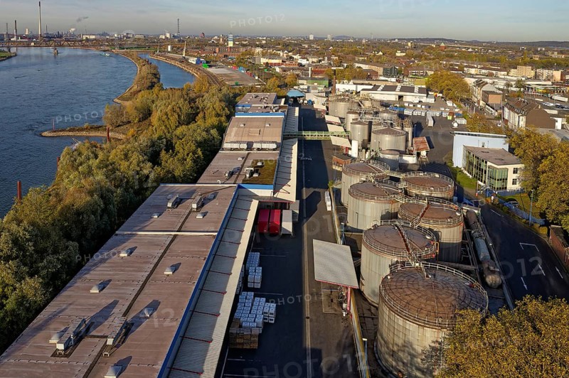 Stainless steel tanks storing chemicals at the Rhine river in Germany. The Chemicals are being repackaged and delivered by truck, box container or tanker to customers