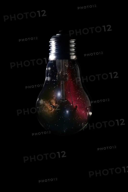 Horsehead Nebula inside of light bulb on dark background Horsehead Nebula deep space beautiful night sky The Horsehead Nebula is a dark nebula in the constellation Orion