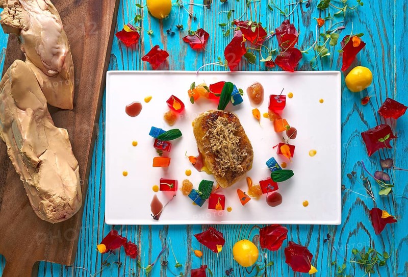 Foie slice with grated white truffle and colorful jelly decoration
