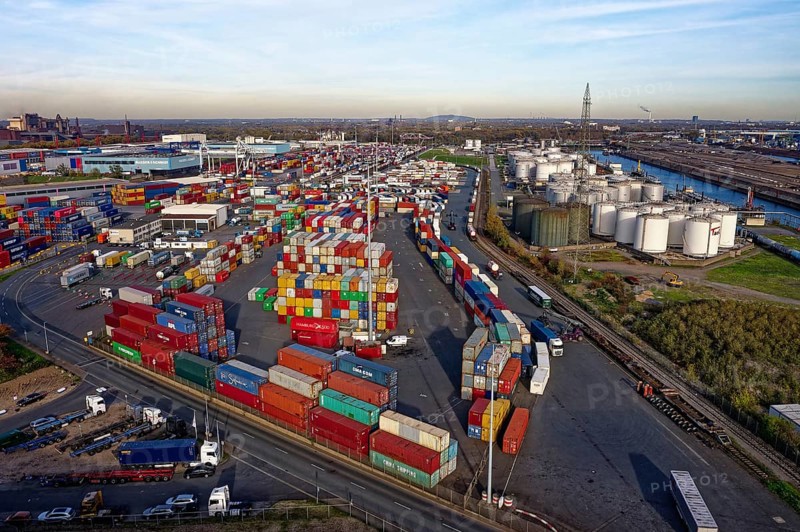 Commercial port with container terminal and oil tanks at the Rhine river in North Rhine-Westphalia, Germany, Europe