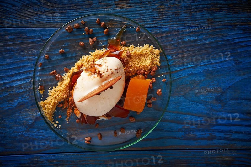 Modern cuisine ice cream dessert with quince vanilla and crunchy