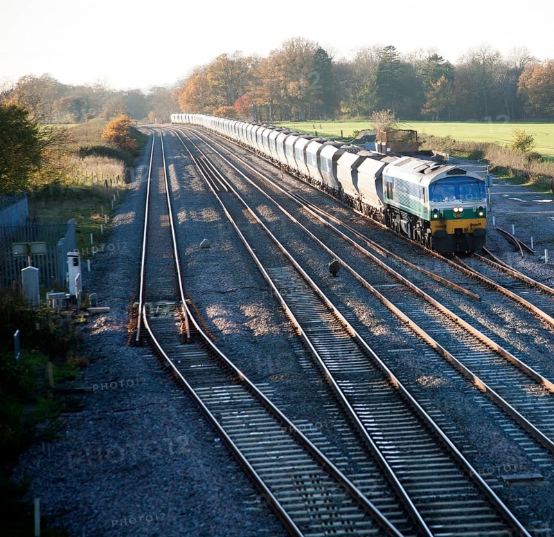 Diesel locomotive freight train on the West Coast mainline at Woodborough, Wiltshire, England, UK