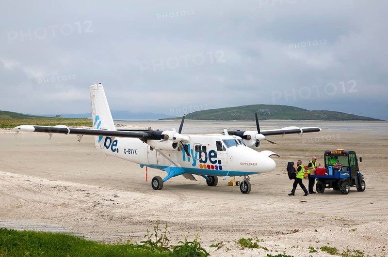 Flybe plane on sandy airstrip Isle of Barra airport, Barra, Outer Hebrides, Scotland, UK