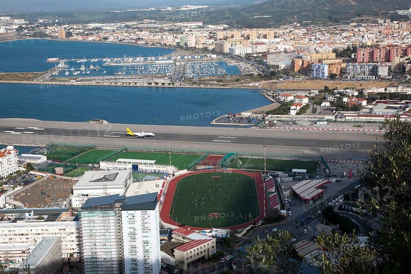 View over airport runway to Spanish town of La Linea from Gibraltar, British overseas territory in southern Europe